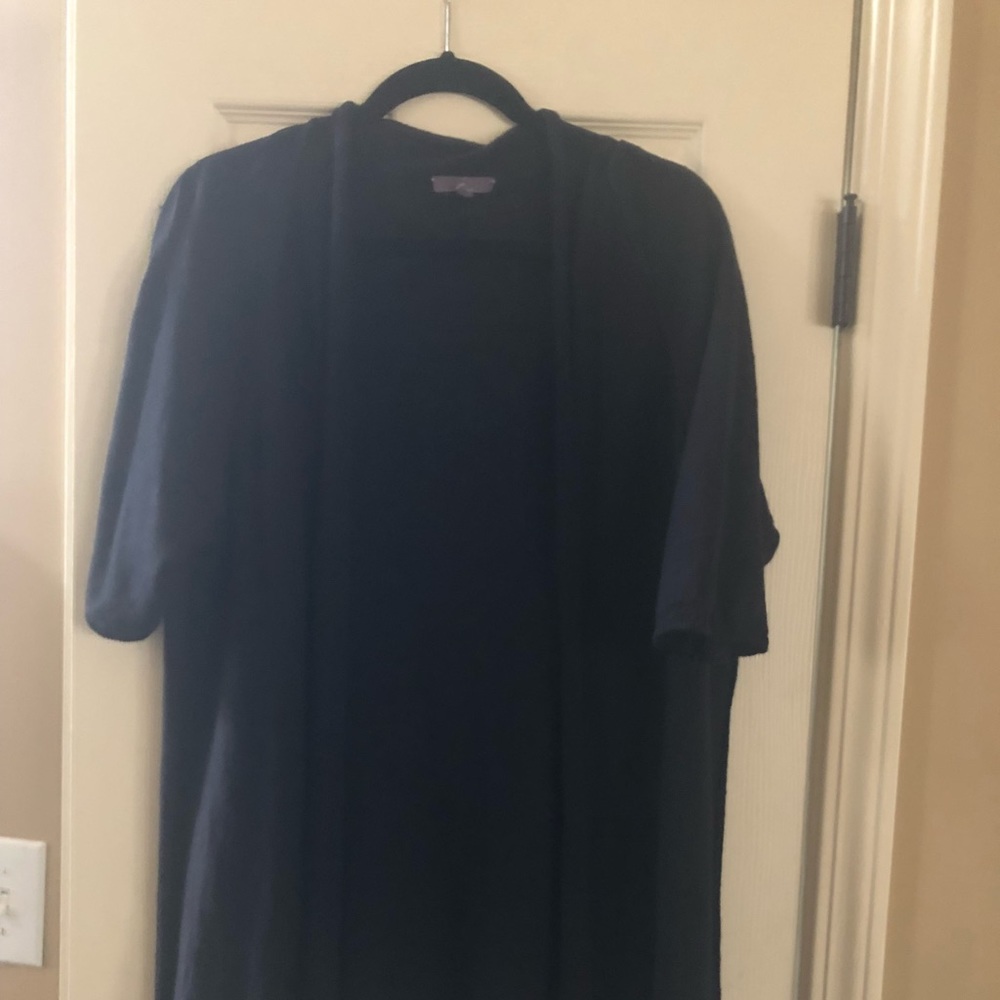 Black cardigan. Below waist length
